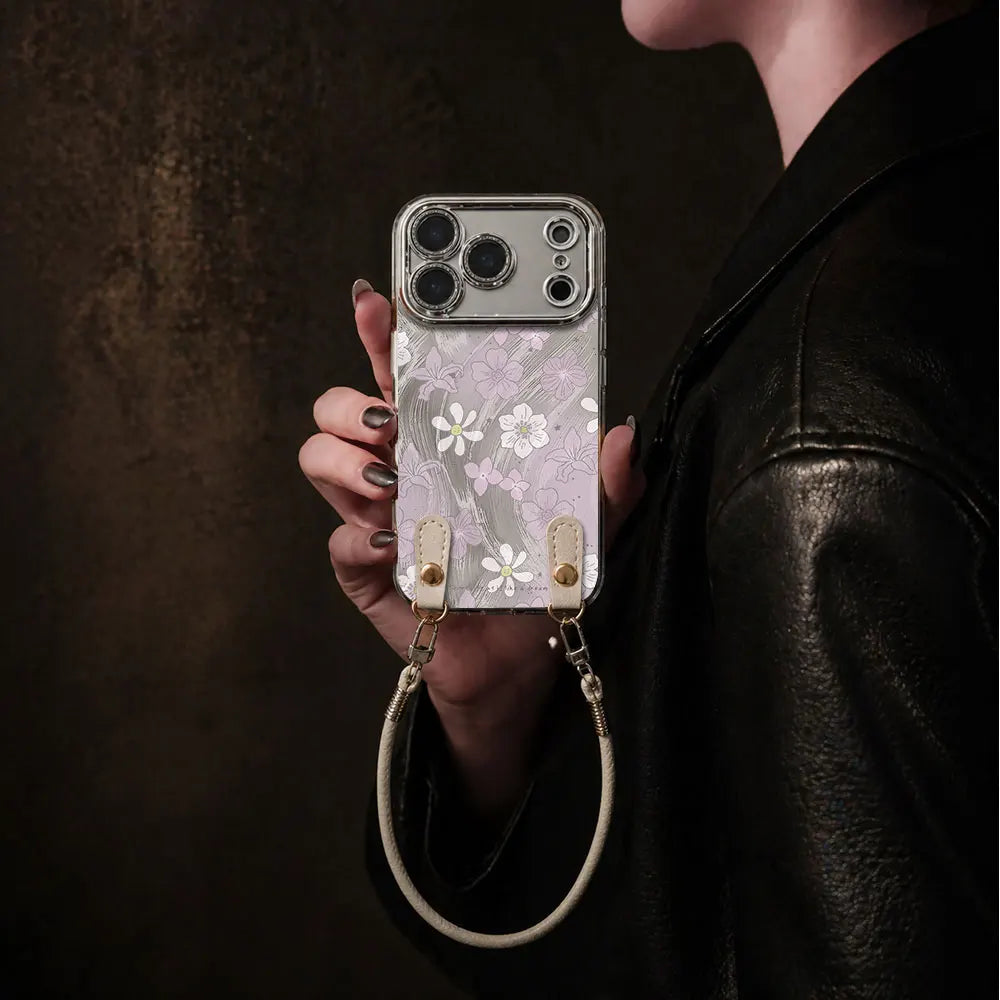 Funda floral lila para iPhone con correa de mano